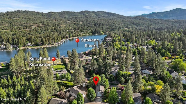 5735 E Steamboat Bnd, Post Falls, ID 83854 - aerial view of property and surrounding area with a heavily wooded area and a water and mountain view