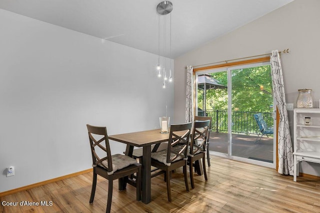 5735 E Steamboat Bnd, Post Falls, ID 83854 - dining area with light wood-type flooring, baseboards, and vaulted ceiling