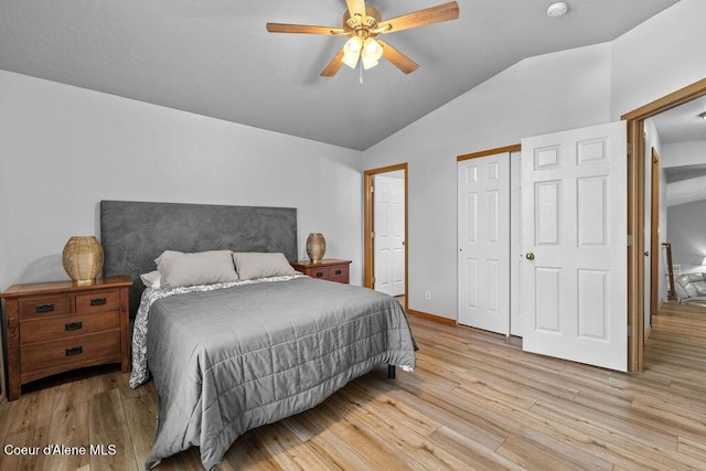 5735 E Steamboat Bnd, Post Falls, ID 83854 - bedroom with lofted ceiling, light wood-type flooring, a closet, baseboards, and ceiling fan