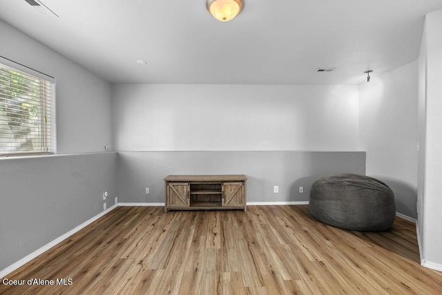5735 E Steamboat Bnd, Post Falls, ID 83854 - empty room with wood finished floors and baseboards