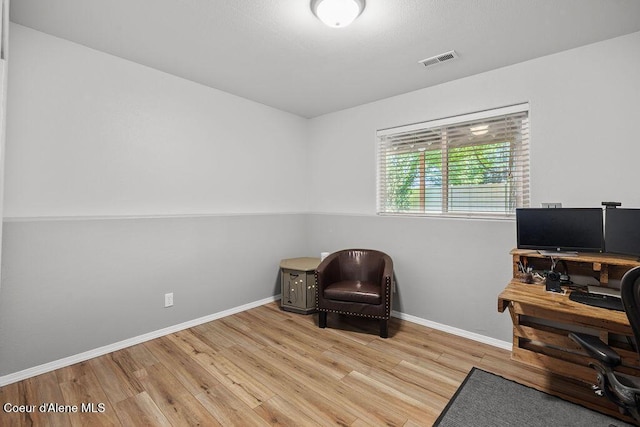 5735 E Steamboat Bnd, Post Falls, ID 83854 - office area featuring wood finished floors and baseboards