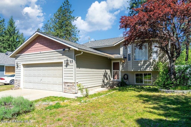 7349 W Crenshaw St, Rathdrum, ID 83858 - tri-level home with an attached garage, a front yard, concrete driveway, and a shingled roof