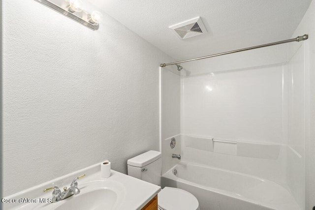7349 W Crenshaw St, Rathdrum, ID 83858 - bathroom with toilet,  shower combination, vanity, a textured wall, and a textured ceiling