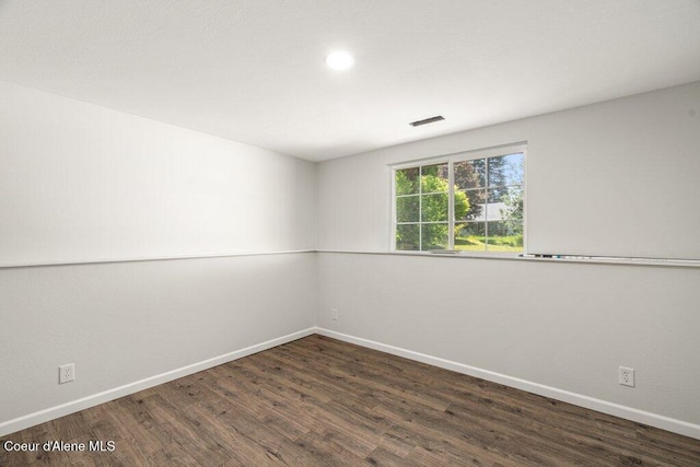 7349 W Crenshaw St, Rathdrum, ID 83858 - empty room featuring wood finished floors, baseboards, and recessed lighting