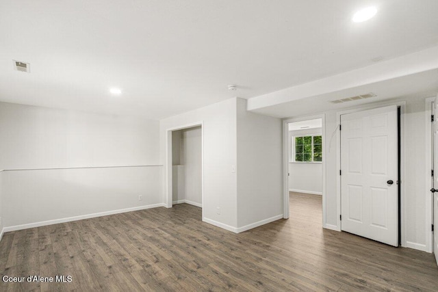 7349 W Crenshaw St, Rathdrum, ID 83858 - spare room with wood finished floors, baseboards, recessed lighting, and a smoke detector