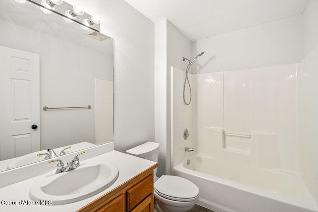 7349 W Crenshaw St, Rathdrum, ID 83858 - bathroom featuring toilet, vanity, and bathing tub / shower combination