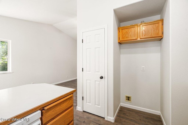 7349 W Crenshaw St, Rathdrum, ID 83858 - laundry room featuring dark wood-style flooring and baseboards