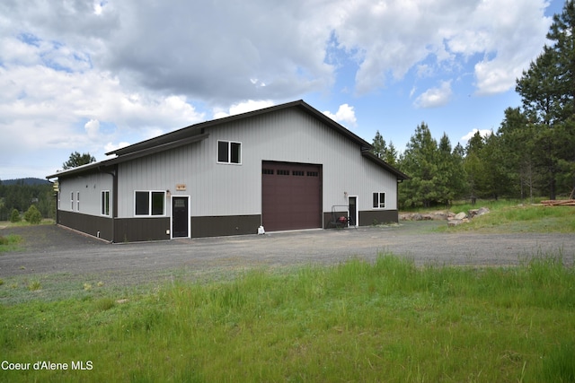 574 Parkside Rd, Plummer, ID 83851 - view of home's exterior with a detached garage and an outbuilding