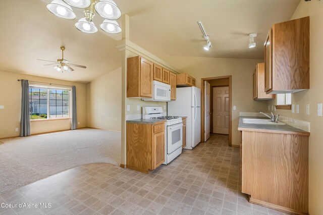 321 E Acorn Ave, Coeur Dalene, ID 83814 - kitchen featuring white appliances, a sink, lofted ceiling, ceiling fan, and open floor plan