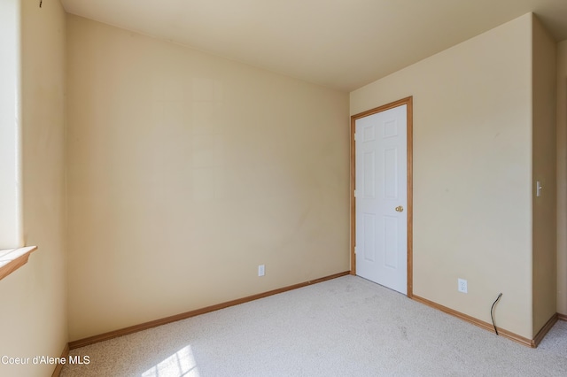 321 E Acorn Ave, Coeur Dalene, ID 83814 - unfurnished room with baseboards and light colored carpet