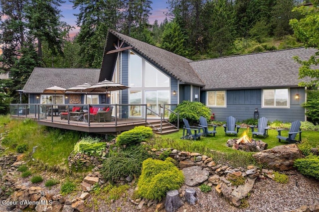 4987 S Bay Pointe Way, Coeur Dalene, ID 83814 - back of house featuring an outdoor fire pit, a wooden deck, and roof with shingles