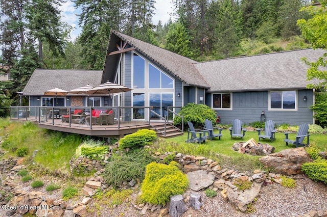 4987 S Bay Pointe Way, Coeur Dalene, ID 83814 - back of house featuring a fire pit, a wooden deck, and roof with shingles