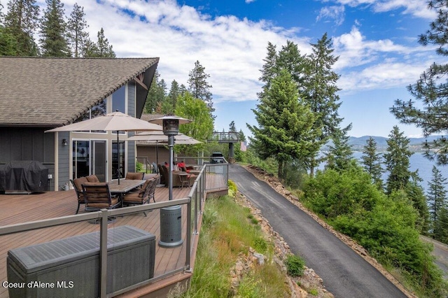 4987 S Bay Pointe Way, Coeur Dalene, ID 83814 - deck with outdoor dining space, grilling area, and a mountain view