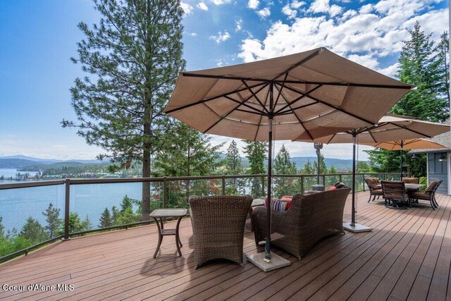4987 S Bay Pointe Way, Coeur Dalene, ID 83814 - deck featuring outdoor dining area and a mountain view
