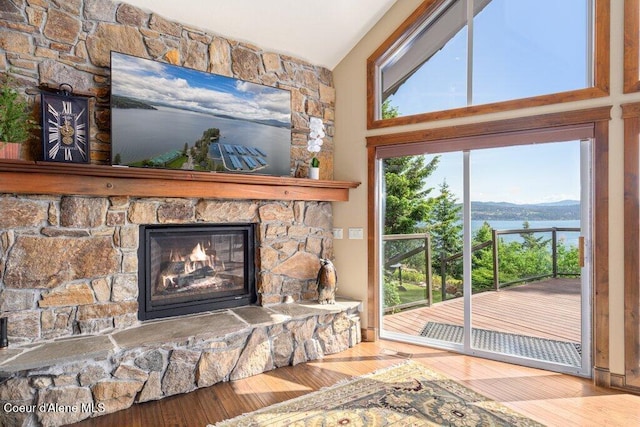 4987 S Bay Pointe Way, Coeur Dalene, ID 83814 - detailed view of wood finished floors and a fireplace