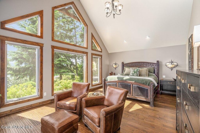 4987 S Bay Pointe Way, Coeur Dalene, ID 83814 - bedroom with high vaulted ceiling, a chandelier, multiple windows, hardwood / wood-style floors, and baseboards