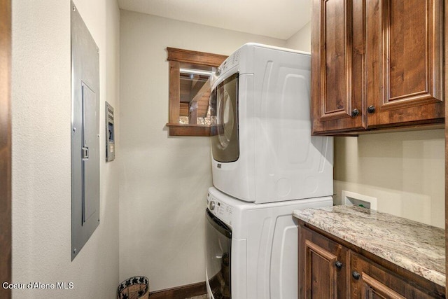 4987 S Bay Pointe Way, Coeur Dalene, ID 83814 - laundry area with cabinet space and stacked washer and clothes dryer