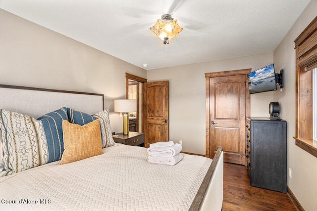 4987 S Bay Pointe Way, Coeur Dalene, ID 83814 - bedroom with dark wood-type flooring and baseboards