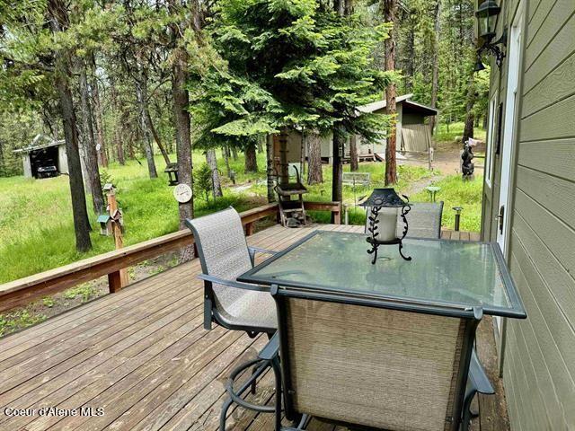 22767 Spruce Ln, Lewiston, ID 83501 - wooden terrace with a lawn and an outbuilding