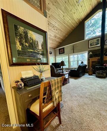 22767 Spruce Ln, Lewiston, ID 83501 - office space featuring high vaulted ceiling, carpet, and wooden ceiling