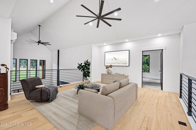 541 N Idaho Club Dr, Sandpoint, ID 83864 - living room featuring high vaulted ceiling, ceiling fan, plenty of natural light, light wood finished floors, and recessed lighting