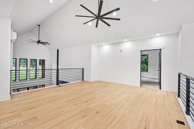 541 N Idaho Club Dr, Sandpoint, ID 83864 - unfurnished living room featuring a ceiling fan, high vaulted ceiling, healthy amount of natural light, recessed lighting, and light wood finished floors