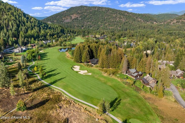 541 N Idaho Club Dr, Sandpoint, ID 83864 - aerial view of property's location featuring a forest, a water and mountain view, and a golf course