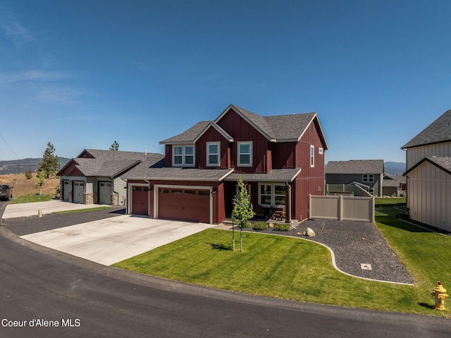 21367 E Acadia Ct, Liberty Lake, WA 99019 - craftsman house featuring a front lawn, concrete driveway, roof with shingles, and an attached garage