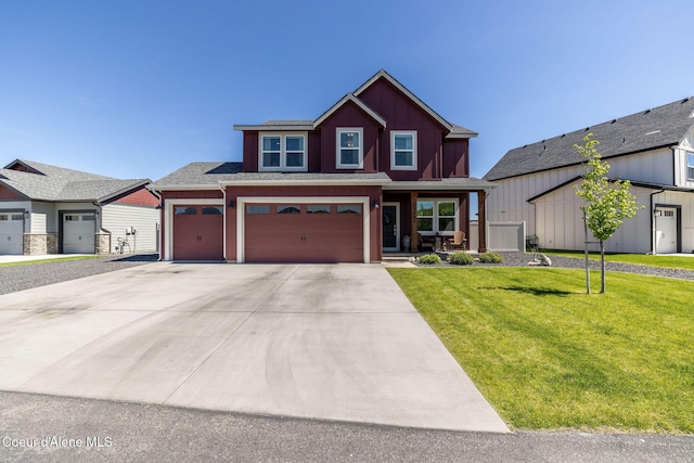 21367 E Acadia Ct, Liberty Lake, WA 99019 - view of front facade featuring a front lawn, driveway, an attached garage, and a shingled roof