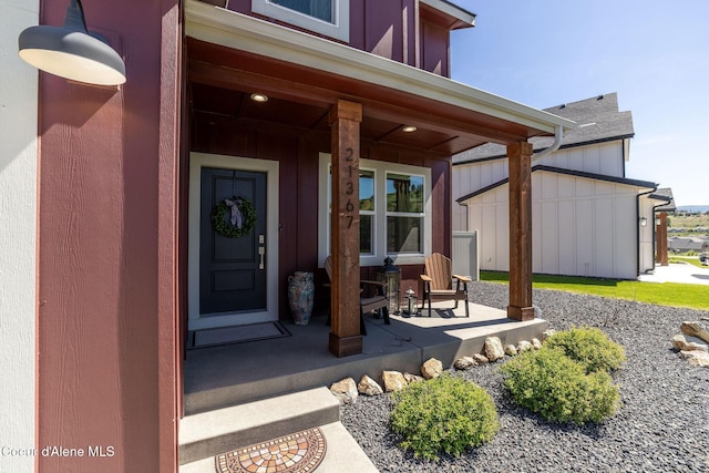 21367 E Acadia Ct, Liberty Lake, WA 99019 - property entrance with covered porch and board and batten siding