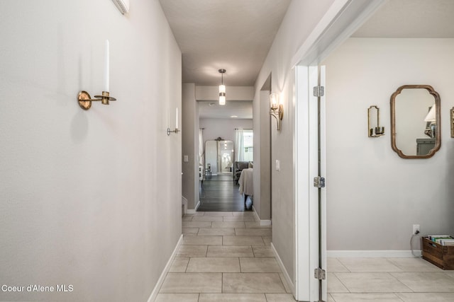 21367 E Acadia Ct, Liberty Lake, WA 99019 - hallway with light tile patterned flooring and baseboards