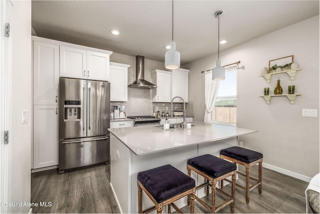 21367 E Acadia Ct, Liberty Lake, WA 99019 - kitchen with wall chimney exhaust hood, appliances with stainless steel finishes, dark wood-type flooring, tasteful backsplash, and recessed lighting