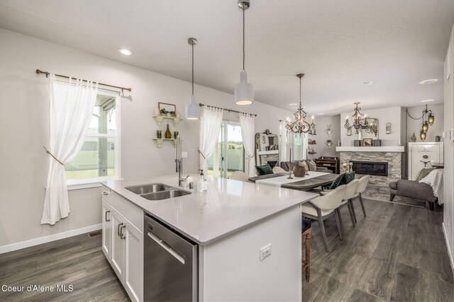 21367 E Acadia Ct, Liberty Lake, WA 99019 - kitchen with dishwasher, dark wood-type flooring, a chandelier, white cabinetry, and a center island with sink