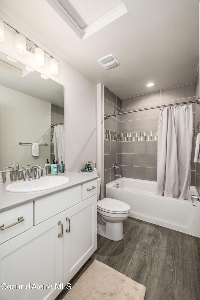 21367 E Acadia Ct, Liberty Lake, WA 99019 - full bathroom with vanity, shower / bath combo, toilet, and wood finished floors