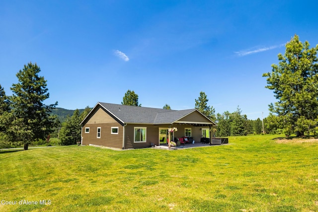 15268 S Potter Rd, Coeur Dalene, ID 83814 - back of property featuring a patio, a lawn, and cooling unit