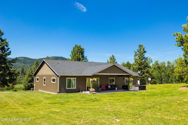 15268 S Potter Rd, Coeur Dalene, ID 83814 - back of house with a patio area and a yard
