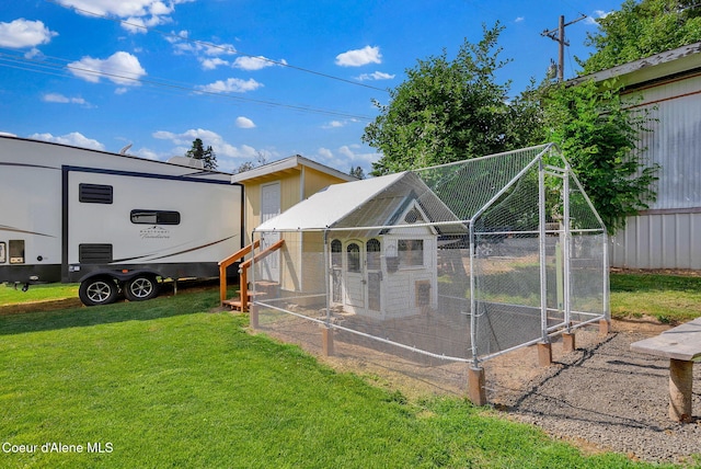 2040 Washington Ave, Saint Maries, ID 83861 - rear view of property featuring exterior structure, an outdoor structure, and a yard