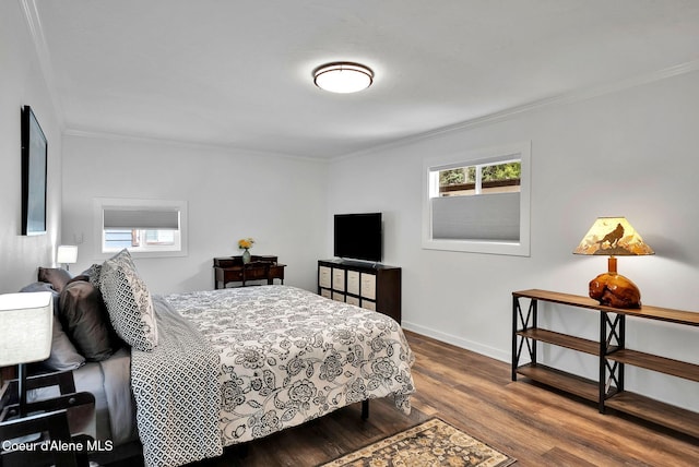 2040 Washington Ave, Saint Maries, ID 83861 - bedroom with crown molding and dark wood-type flooring