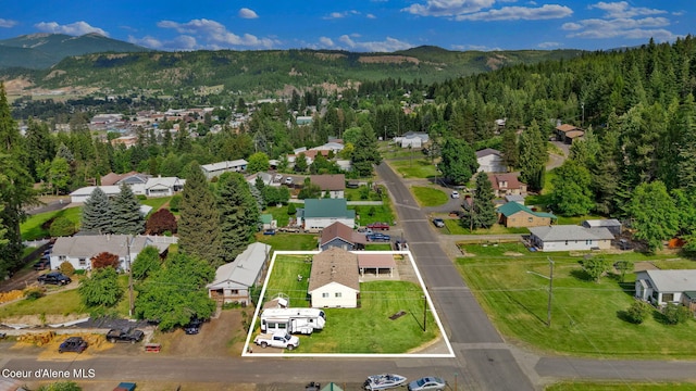 2040 Washington Ave, Saint Maries, ID 83861 - aerial view of property's location featuring property parcel outlined, mountains, and nearby suburban area
