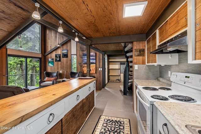 852 Woodland Dr, Sandpoint, ID 83864 - kitchen with electric stove, exhaust hood, wood ceiling, butcher block counters, and lofted ceiling