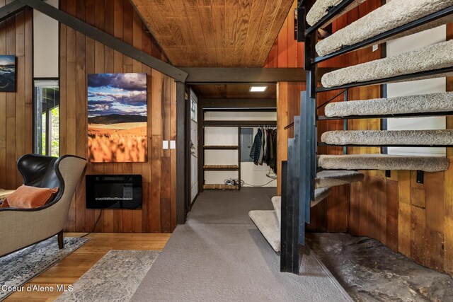 852 Woodland Dr, Sandpoint, ID 83864 - interior space featuring stairs, wood walls, wooden ceiling, wood finished floors, and lofted ceiling