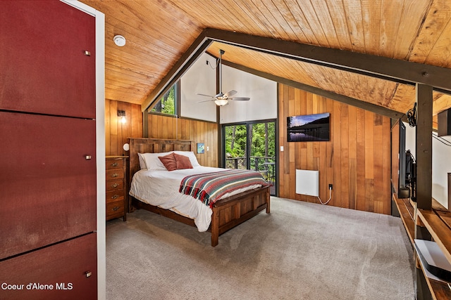 852 Woodland Dr, Sandpoint, ID 83864 - bedroom with wooden ceiling, wood walls, carpet, and vaulted ceiling
