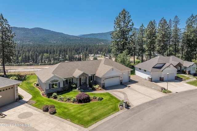 620 N Chisholm Ct, Post Falls, ID 83854 - view of subject property featuring a heavily wooded area and a mountainous background