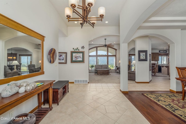 620 N Chisholm Ct, Post Falls, ID 83854 - entrance foyer with arched walkways, light tile patterned floors, recessed lighting, a ceiling fan, and a chandelier