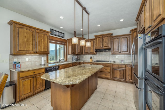 620 N Chisholm Ct, Post Falls, ID 83854 - kitchen featuring dishwasher, black oven, brown cabinets, under cabinet range hood, and recessed lighting