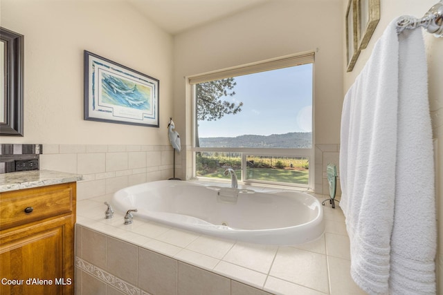 620 N Chisholm Ct, Post Falls, ID 83854 - bathroom featuring a whirlpool tub, vanity, and a mountain view