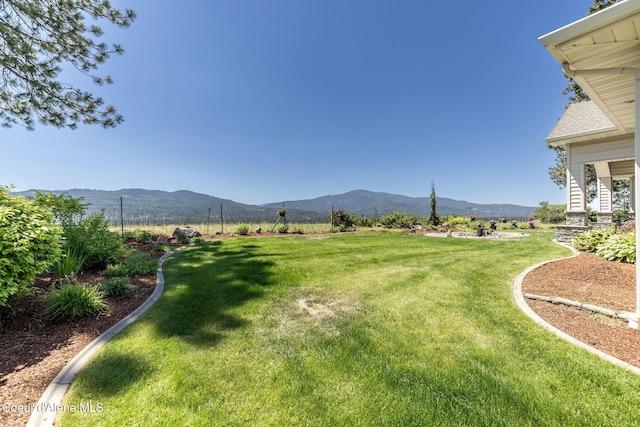 620 N Chisholm Ct, Post Falls, ID 83854 - view of green lawn featuring a mountain view