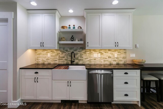 245 Lost Creek Ln, Priest River, ID 83856 - kitchen featuring stainless steel dishwasher, dark countertops, a sink, open shelves, and white cabinetry