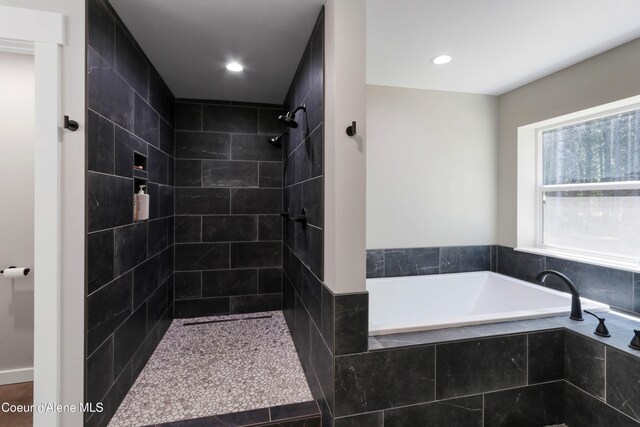 245 Lost Creek Ln, Priest River, ID 83856 - bathroom with a bath, tiled shower, and recessed lighting