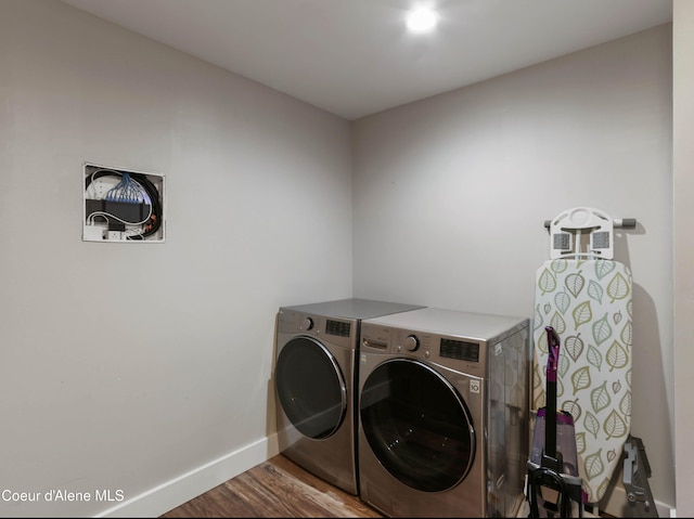 245 Lost Creek Ln, Priest River, ID 83856 - washroom featuring washing machine and dryer, wood finished floors, and baseboards